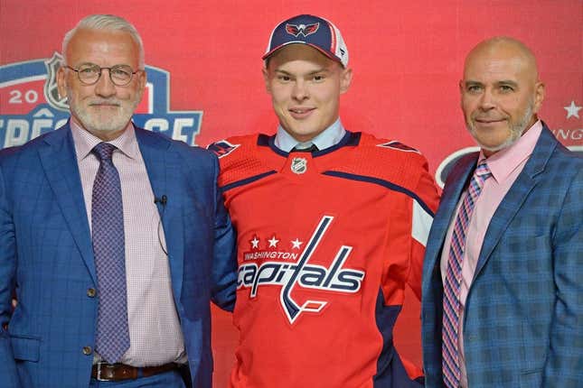 Jul 7, 2022; Montreal, Quebec, CANADA; Ivan Miroshnichenko after being selected as the number twenty overall pick to the Washington Capitals in the first round of the 2022 NHL Draft at Bell Centre.
