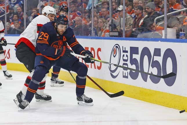 Mar 14, 2023; Edmonton, Alberta, CAN; Edmonton Oilers forward Leon Draisaitl (29) and Ottawa Senators defensemen Jakob Chychrun (6) battle along the boards for a loose puck during the first period at Rogers Place.