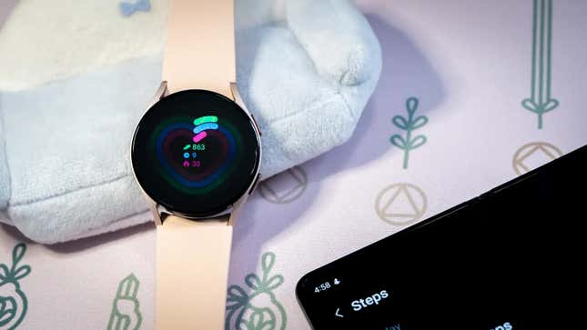 A Galaxy Watch 5 alongside a phone reading "steps."