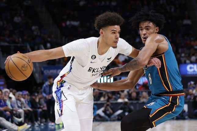 Apr 5, 2023; Detroit, Michigan, USA;  Brooklyn Nets forward Cameron Johnson (2) dribbles on Detroit Pistons guard Jared Rhoden (8) in the first half at Little Caesars Arena.