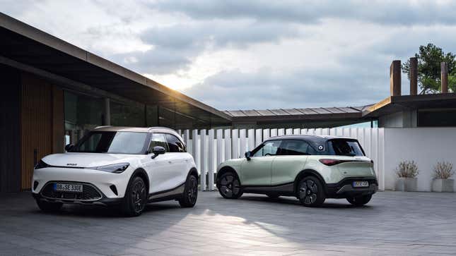 A photo of two Smart SUV concept cars. 