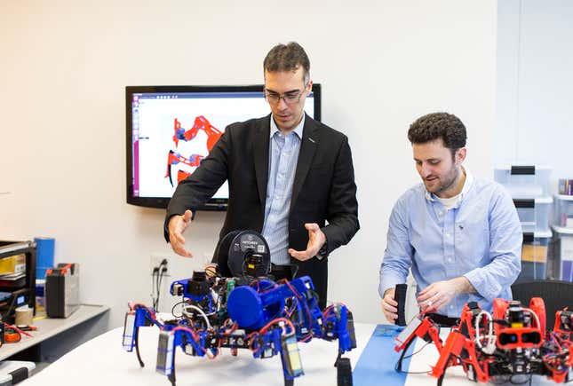 Dalloro comparing robots with a teammate.