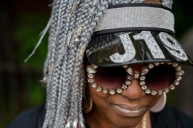 Boston, MA - June 19: A woman poses for a photo wearing a hat that reads “J19&quot; at the 13th annual Juneteenth Emancipation Flag Raising and Parade hosted by the Boston Juneteenth Committee and the Museum of the National Center of Afro American Artists (NCAAA)