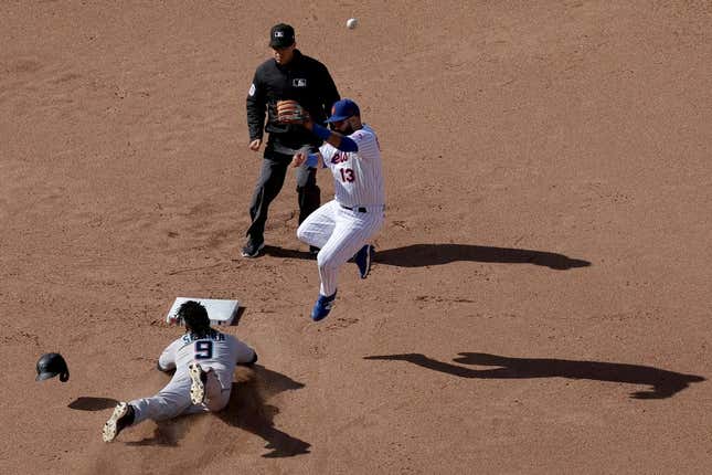 Apr 9, 2023; New York City, New York, USA; Miami Marlins third baseman Jean Segura (9) steals second base as the throw goes over New York Mets second baseman Luis Guillorme (13) allowing Segura to take third base during the eighth inning at Citi Field.