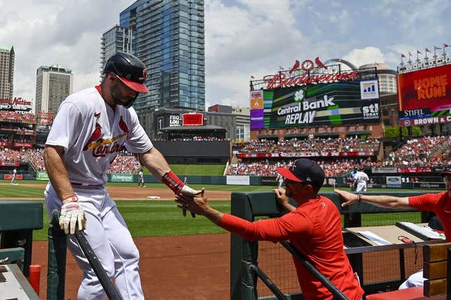 May 7, 2023; St. Louis, Missouri, USA;  St. Louis Cardinals first baseman Paul Goldschmidt (46) is congratulated by manager Oliver Marmol (37) after hitting a solo home run against the Detroit Tigers during the third inning at Busch Stadium.