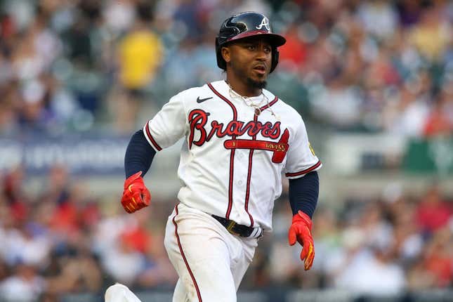 Jun 15, 2023; Atlanta, Georgia, USA; Atlanta Braves second baseman Ozzie Albies (1) hits a single against the Colorado Rockies in the first inning at Truist Park.
