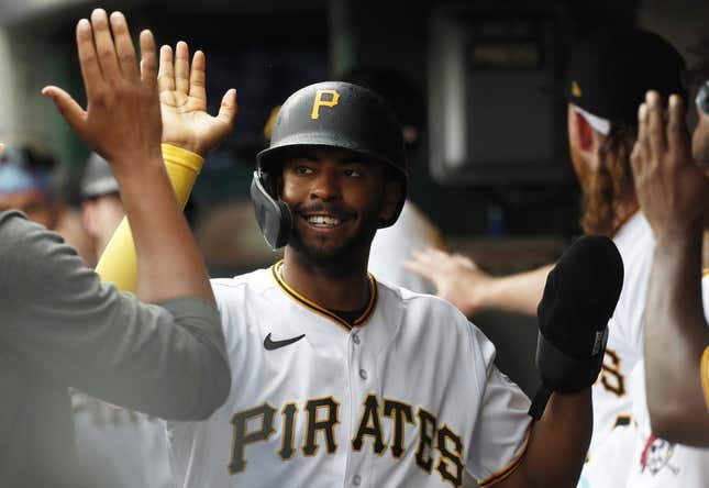 Aug 10, 2023; Pittsburgh, Pennsylvania, USA; Pittsburgh Pirates left fielder Josh Palacios (54) high-fives in the dugout after scoring a run against the Atlanta Braves during the third inning at PNC Park.
