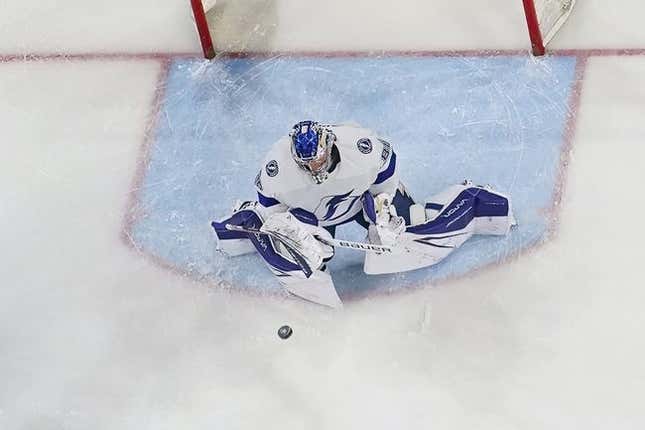 Mar 28, 2023; Raleigh, North Carolina, USA;  Tampa Bay Lightning goaltender Andrei Vasilevskiy (88) makes a save against the Carolina Hurricanes during the second period at PNC Arena.