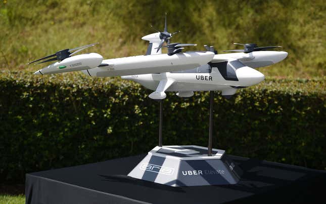 A model of Uber’s electric vertical take-off and landing vehicle concept (eVTOL) flying taxi is displayed at the second annual Uber Elevate Summit, on May 8, 2018 at the Skirball Center in Los Angeles, California