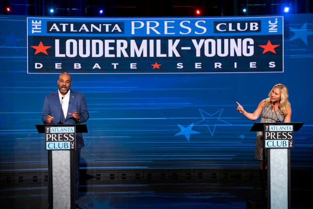 Democratic challenger Marcus Flowers, left, and U.S. Rep. Marjorie Taylor Greene, R-Ga., debate in the race for the 14th Congressional District during the Atlanta Press Club Loudermilk-Young Debate Series in Atlanta, Sunday, Oct. 16, 2022.