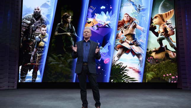 Sony CEO Jim Ryan speaking on stage at CES 2023, with images of popular PlayStation game characters on a screen behind him. 
