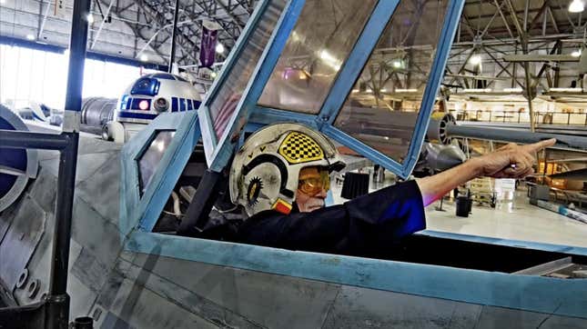 Colin Cantwell, the designer of the X-Wing, sits in a replica model at the Denver Air and Space Museum 