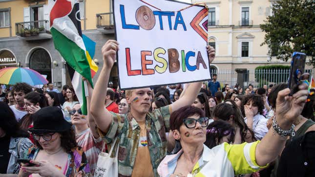 AVELLINO, ITALY - JUNE 10: A person holds up a sign that reads: "Lotta lesbica" (Lesbian struggle) during the 2023 Irpinia Pride Parade for LGBTQ+ rights on June 10, 2023 in Avellino, Italy. On June 10, 2023, the traditional appointment with Pride returns in defense of LGBTQ+ rights, in various Italian cities. It is the first appointment in a series of marches and parades scheduled in many Italian cities after the controversy over the revocation of moral patronage carried out by the governments of the Lazio Region and the Lombardy Region, motivated by the positions against surrogacy by the councils of two regions administered by centre-right coalitions. (Photo by Ivan Romano/Getty Images)