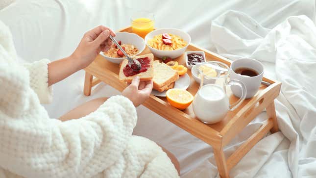 woman having breakfast in bed