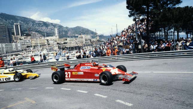 A red Ferrari 126C on the streets of Monaco in the 1980s.