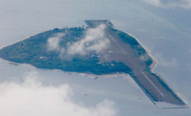 The Philippine-claimed Thitu Island on the Spratlys chain of islands is shown off the disputed South China Sea in western Philippines Friday, April 21, 2017. Philippine Defense Secretray Delfin Lorenzana, Armed Forces Chief Gen. Eduardo Ano and other officials flew to the island Friday to assert the country's claim to the heartland of the disputed area where China is believed to have added missiles on man-made islands. The South China Sea issue is expected to be discussed in the 20th ASEAN Summit of Leaders next week.