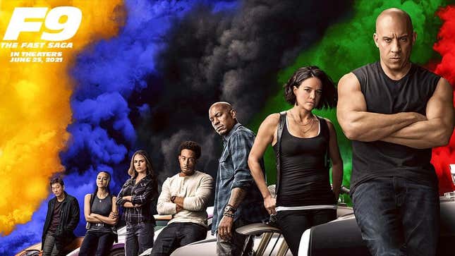 The cast of F9 lean on cars with colorful smoke behind them.