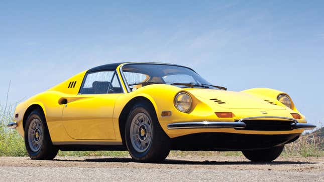A photo of a yellow Ferrari Dino 246 GTS. 