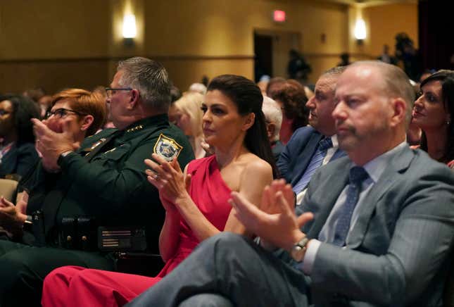 Florida first lady Casey DeSantis, center, applauds during a debate between her husband, Republican Gov. Ron DeSantis, and former Gov. Charlie Crist, D-Fla., at the Sunrise Theatre, Monday, Oct. 24, 2022, in Fort Pierce, Fla.