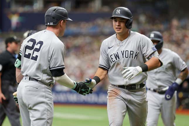 Aug 27, 2023; St. Petersburg, Florida, USA; New York Yankees center fielder Harrison Bader (22) congratulates shortstop Anthony Volpe (11) after hitting a two run home run against the Tampa Bay Rays in the fourth inning at Tropicana Field.