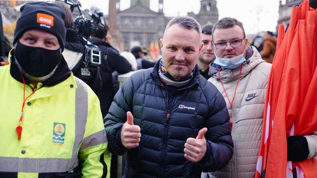 SMB unionist Chris Mitchell flashes a thumbs up.