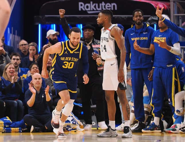 Mar 31, 2023; San Francisco, California, USA; Golden State Warriors guard Stephen Curry (30) smiles as he returns to defense after scoring a three point basket against the San Antonio Spurs during the second quarter at Chase Center.