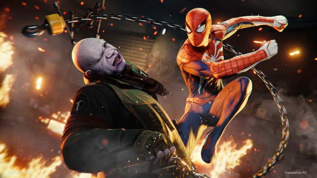 Spiderman punches a bald bad guy.
