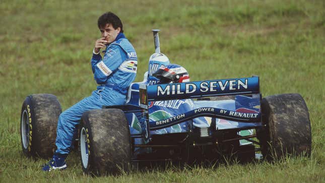 Jean Alesi sits on the front of his 1996 Benetton F1 car. 