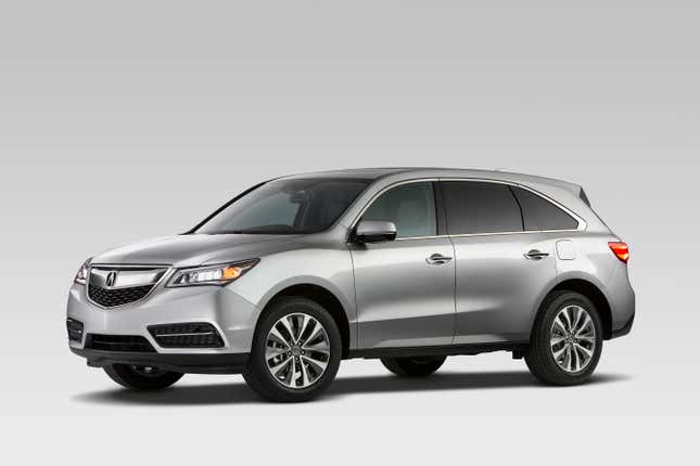 A silver 2015 Acura MDX on a white background