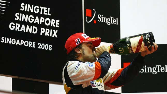 Fernando Alonso celebrates at the controversial 2008 Singapore Grand Prix.