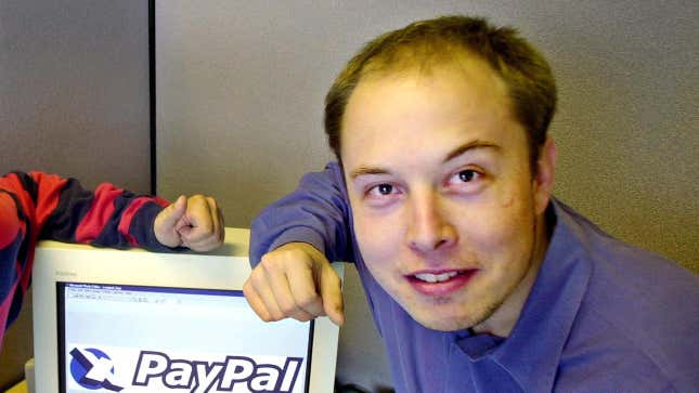 Elon Musk in a file photo from Oct. 20, 2000 posing with the PayPal logo at PayPal’s corporate headquarters in Palo Alto, Calif