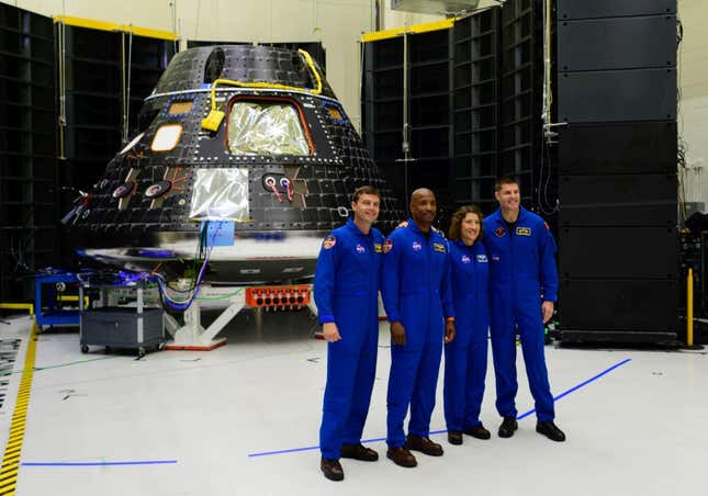 The Artemis 2 crew pose with the Orion spacecraft at NASA’s Kennedy Space Center in Florida.