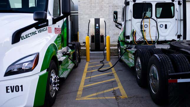 Daimler Freightliner eCascadia all-electric semitrucks charge at a Meijer distribution center in Lansing, Michigan, US, on Tuesday, Feb. 14, 2023. The Grand Rapids, Michigan-based retailer is the first nationwide to track the performance of the Freightliner eCascadia semitrucks in a cold weather environment as part of a grant from the U.S. Department of Energy. 
