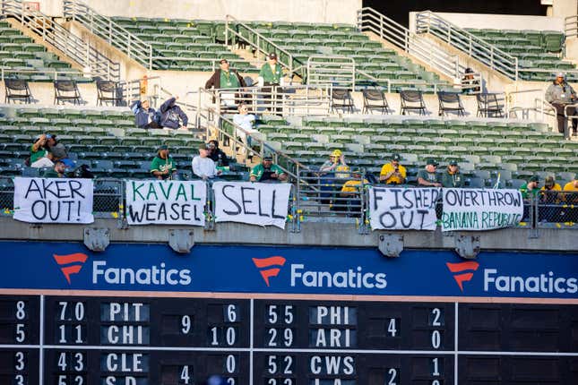 Fans protest Oakland ownership during the Major League Baseball game between the Tampa Bay Rays and the Oakland Athletics 