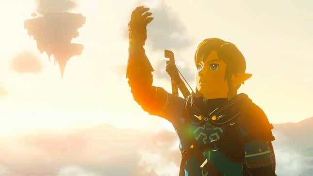 Link looks at his arm as the sun sets. 