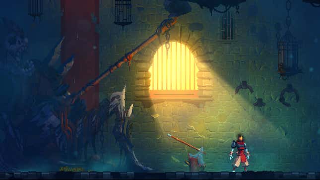 The main character of Dead Cells stands in a dungeon.