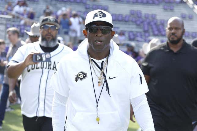 Sep 2, 2023; Fort Worth, Texas, USA; Colorado Buffaloes head coach Deon Sanders walks on the field before the game against the TCU Horned Frogs at Amon G. Carter Stadium.