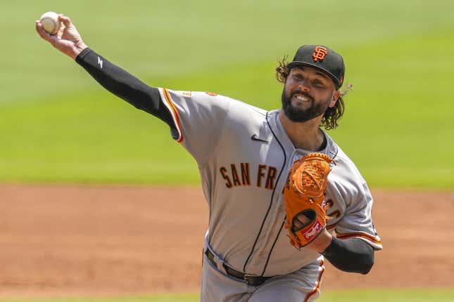 Aug 20, 2023; Cumberland, Georgia, USA; San Francisco Giants pitcher Jakob Junis (34) pitches against the Atlanta Braves during the first inning at Truist Park.