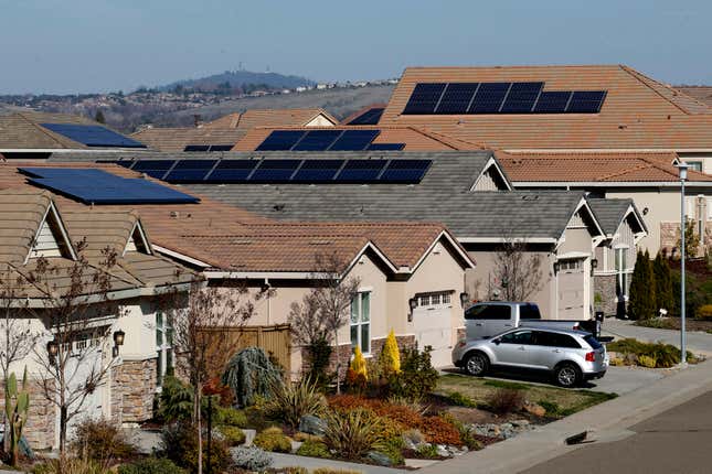 Solar panels sit atop homes in California.