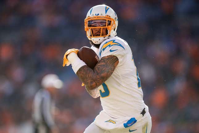 Jan 8, 2023; Denver, Colorado, USA; Los Angeles Chargers wide receiver Keenan Allen (13) catches the ball and runs for a touchdown in the first quarter against the Denver Broncos at Empower Field at Mile High.