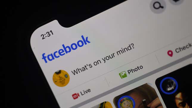 A Facebook newsfeed page is displayed on a smartphone.