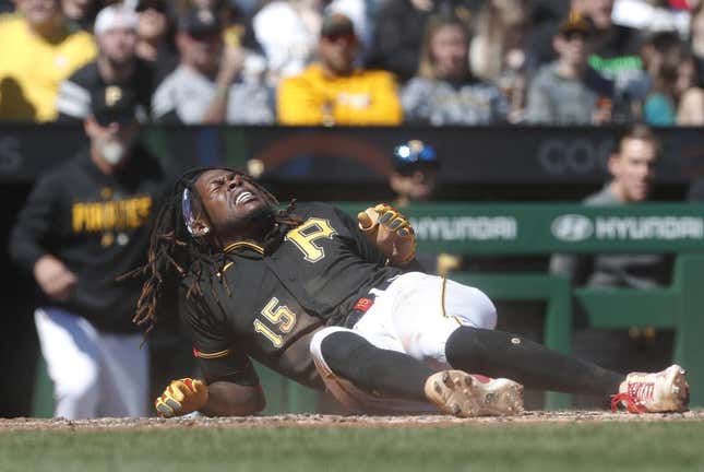 Apr 9, 2023; Pittsburgh, Pennsylvania, USA; Pittsburgh Pirates shortstop Oneil Cruz (15) reacts after collision at home plate against the Chicago White Sox during the sixth inning at PNC Park. Cruz would exit the game.