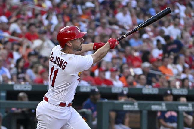 Jun 27, 2023; St. Louis, Missouri, USA;  St. Louis Cardinals shortstop Paul DeJong (11) hits a one run sacrifice fly against the Houston Astros during the fourth inning at Busch Stadium.