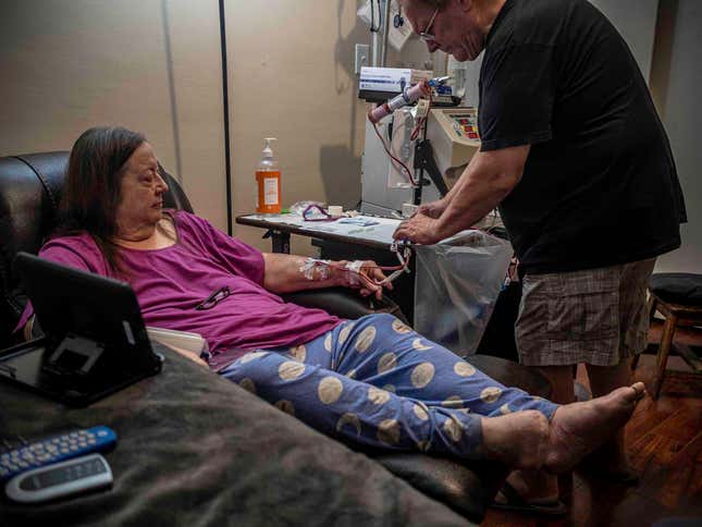 Jo undergoes home hemodialysis four times per week in a small spare room containing a lounger, a TV and a dialysis machine. She and her husband have been trained to administer the dialysis routine.
