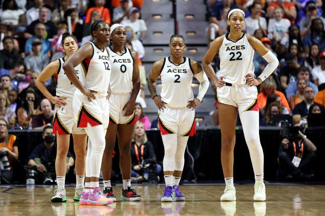 (L-R) Kelsey Plum #10, Chelsea Gray #12, Jackie Young #0, Riquna Williams #2 and A’ja Wilson #22 of the Las Vegas Aces react in the second half against the Connecticut Sun during game four of the 2022 WNBA Finals at Mohegan Sun Arena on September 18, 2022 in Uncasville, Connecticut. (Photo by Maddie Meyer/Getty Images)
