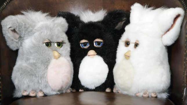 A trio of Furbies gather to discuss the strange secrets kept by Furbykind.