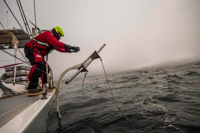 A researcher throws a trawl into the Atlantic Ocean during a 2014 expedition. 