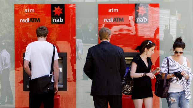 File photo of Australians using ATMs for one of Australia’s four major banks.