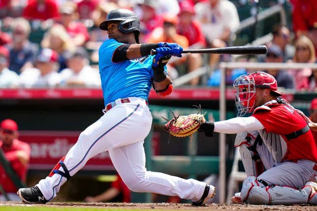 Mar 22, 2023; Jupiter, Florida, USA; Miami Marlins second baseman Jean Segura (9) hits a single against the St. Louis Cardinals during the fourth inning at Roger Dean Stadium.