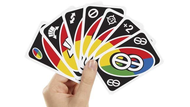 A hand holding seven Wild Uno cards from the new Uno All Wild game. 